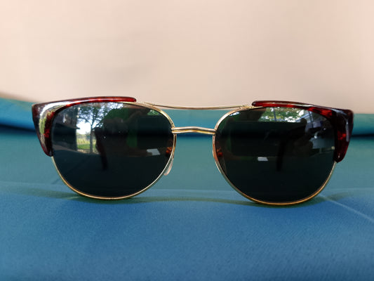 Ochelari de soare eleganți, cu ramă aurie și brațe cu model animal print